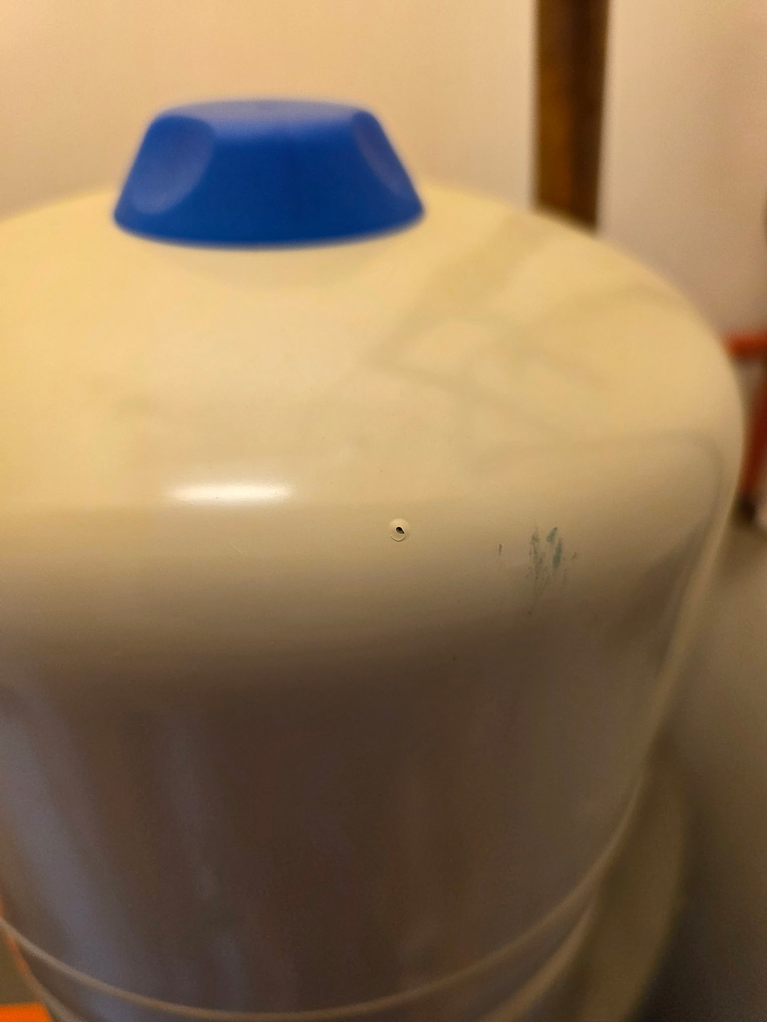 Closeup of the pinhole leak in the expansion tank wall